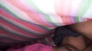 A girl with a big ass enjoys intimate moments under the sheets with her partner