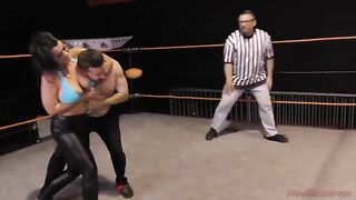 Nadia White dominates Glenn King in a fierce wrestling match
