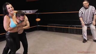 Nadia White dominates Glenn King in a fierce wrestling match