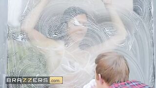 Ruby Sims flaunts her lingerie to the window cleaner in a steamy Brazzers scene