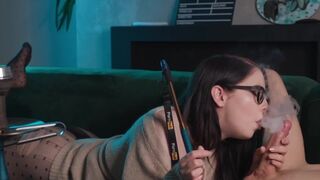 A girl in glasses smokes and sucks cock while I eat her pussy in 69 position