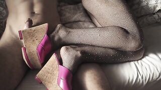 A seductive girl in high heels and pantyhose is teasing on camera