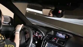 Babe fucks with a stranger in the car in the parking lot