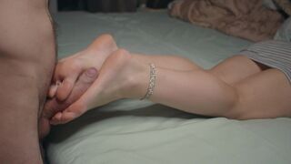 A small feet girl gets her feet worshiped and cummed on after a footjob