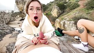Two pretty girls have fun with a man on the beach