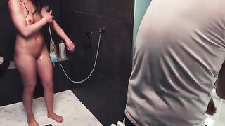 Babe gets a messy handjob in the shower