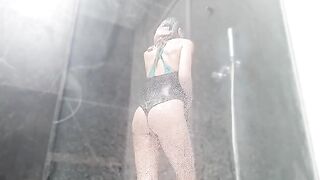 Babe masturbates to squirting orgasm in the shower, her pussy drenched with wetness