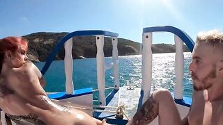 A hot redhead is having fun on a boat with someone special