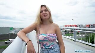 Irina Cage flashes her tits and ass on a bridge for cash
