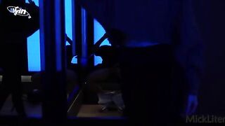 A girl is trying on clothes and does not let a guy do it for her in the fitting room
