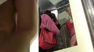 A spy filming a naked girl in the locker room of the store