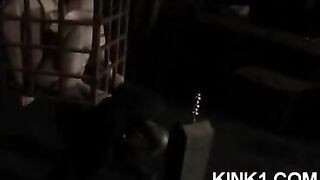 The slave in the cage fulfills all the master's orders