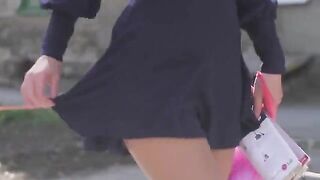 A very beautiful girl is removing her clothes