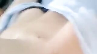 A half-naked lie and caress her body with her hands in this hot video