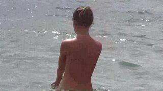 A hot girl is fucking on the naked beach in HD