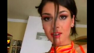A cute woman masturbates her sweet pussy in a leather chair