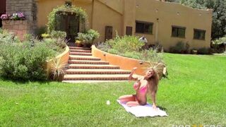A hot blonde is fucking on the lawn in a steamy scene