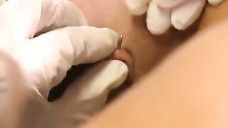 A girl with a pierced clitoris plays with sex toys in 91porn