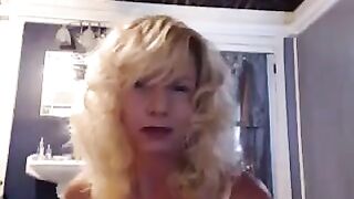 A woman of experience has fun in the bathroom with a toy