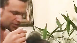 A 40-year-old man playing a joke, touching the girl's nipples
