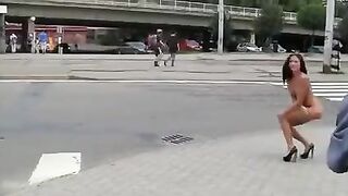 A young and sexy brunette exposes her body in public