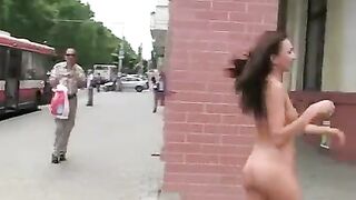 A young and sexy brunette exposes her body in public