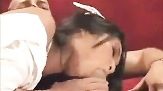 Asian nurse in sexy uniform fucks with a guy on the couch