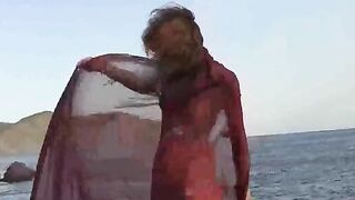 Nudist girl has small boobs and gets wet in the rain