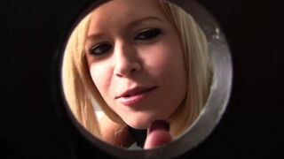 A blondie pulled a cock through the toilet hole and began to suck it greedily