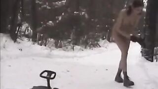 Naked beauties play snowballs in the street on a cold winter day