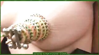 A woman gets her labia pierced with needles in the lab