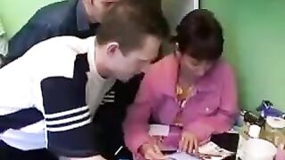 A Russian mother with big natural boobs is sharing cock with three guys