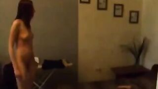 The beautiful Russian girl caresses herself in the kitchen