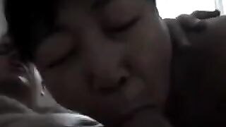 The Chinese woman practices her blowjob skills on her boyfriend