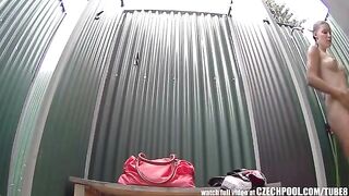 A girl washes herself in the shower, unaware of a hidden camera