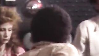 Retro swingers fuck with parents in a wild orgy scene, reminiscent of a whorish strip club vibe