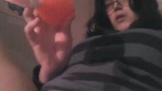 The girl plays with her clit using a powerful vibrator on the bed