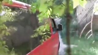 The man squeezed tits of girl near a car
