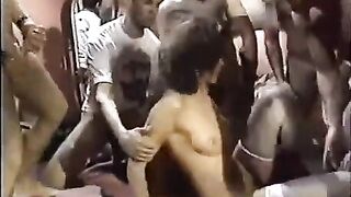 A young whore in stockings has sex with a lot of guys