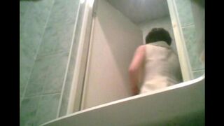 A girl is peeing after graduation on a hidden camera