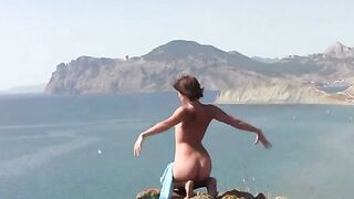 A girl is waiting for her partner on the beach naked