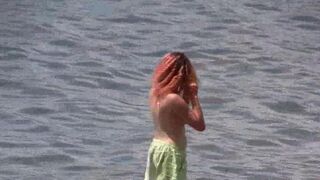A hot nudist is walking on the beautiful beaches of Crimea
