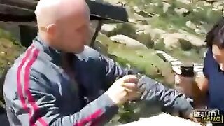 A girl with dark hair is having fun with a stranger
