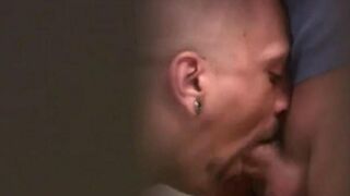 Public toilet scene with guys engaging in intimate acts