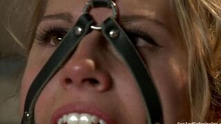 A woman is tied up and her tits are being clamped with nipple clamps