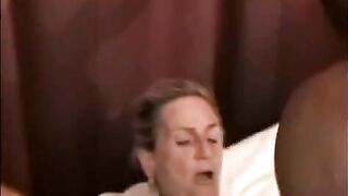 A mature woman fucked by a black man with big cock