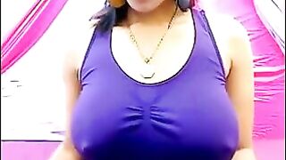 The nipples of a excited brunette are visible through her T-shirt