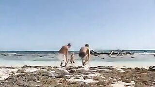 Blonde woman has sex with two guys on the beach