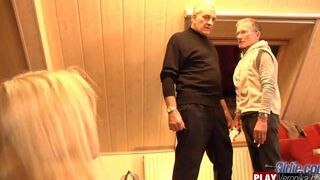 A young blonde has sex with a bearded man with gray hair