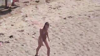 A pair of naked people enjoy each other in the sea